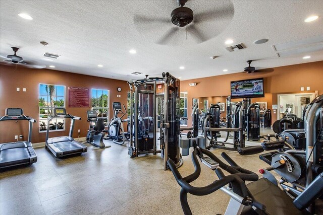 10557 Pisa Rd, Wellington, FL 33414 - exercise room featuring a ceiling fan, a textured ceiling, recessed lighting, and baseboards