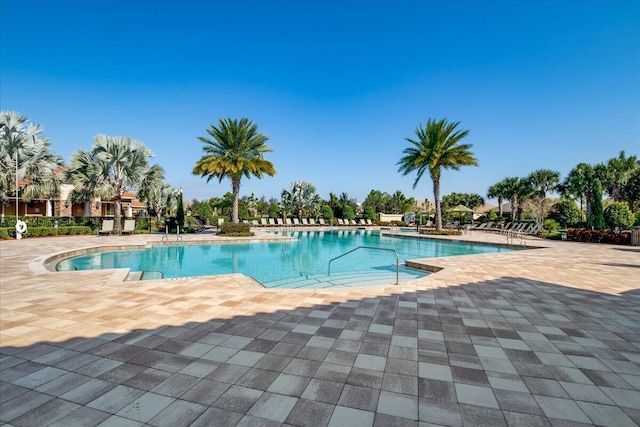 10557 Pisa Rd, Wellington, FL 33414 - community pool featuring a patio