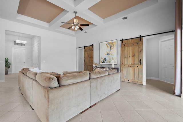 10557 Pisa Rd, Wellington, FL 33414 - living area with a barn door, light tile patterned floors, coffered ceiling, a ceiling fan, and baseboards