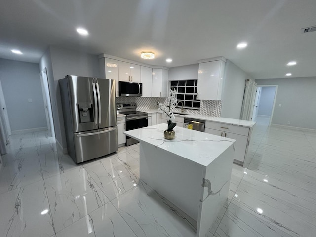 1720 SW 13th St, Boca Raton, FL 33486 - kitchen featuring appliances with stainless steel finishes, modern cabinets, baseboards, recessed lighting, and white cabinetry