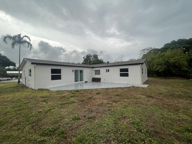 1720 SW 13th St, Boca Raton, FL 33486 - back of house with a patio area, stucco siding, and a lawn