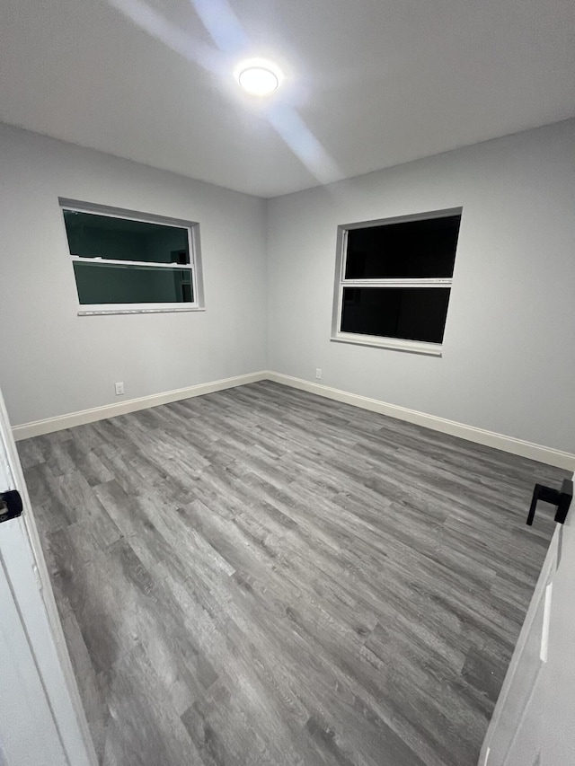 1720 SW 13th St, Boca Raton, FL 33486 - unfurnished room featuring wood finished floors and baseboards