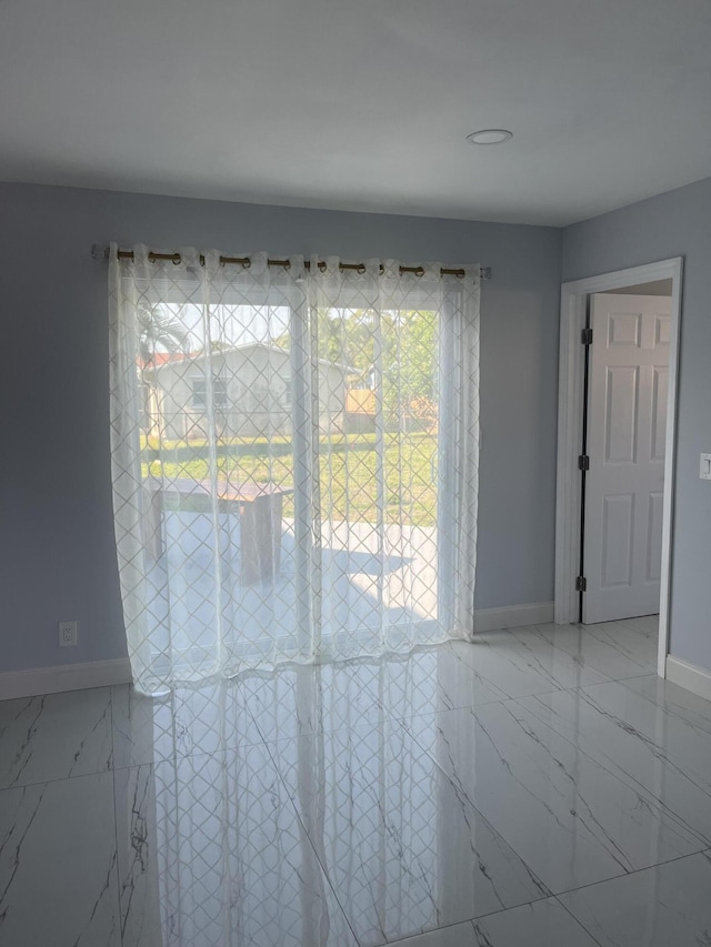 1720 SW 13th St, Boca Raton, FL 33486 - unfurnished room with marble finish flooring and baseboards