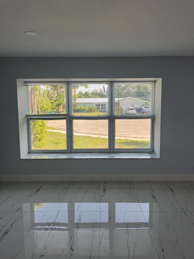 1720 SW 13th St, Boca Raton, FL 33486 - unfurnished room featuring baseboards and marble finish flooring