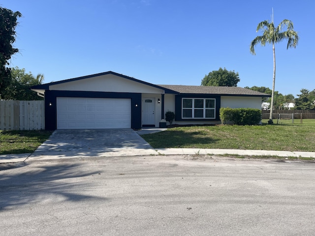 1720 SW 13th St, Boca Raton, FL 33486 - ranch-style home with an attached garage, concrete driveway, and stucco siding