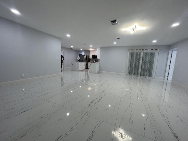 1720 SW 13th St, Boca Raton, FL 33486 - unfurnished living room featuring light marble finish floors, recessed lighting, and baseboards