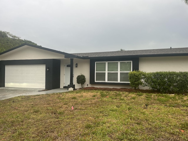 1720 SW 13th St, Boca Raton, FL 33486 - ranch-style house with stucco siding, a garage, concrete driveway, and a front yard