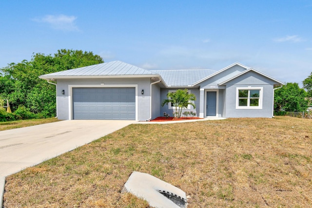 3269 NW 24th Ave, Okeechobee, FL 34972 - ranch-style house with a garage, concrete driveway, stucco siding, and a front yard