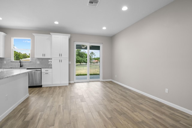 3269 NW 24th Ave, Okeechobee, FL 34972 - kitchen featuring stainless steel dishwasher, plenty of natural light, light wood-style flooring, and recessed lighting