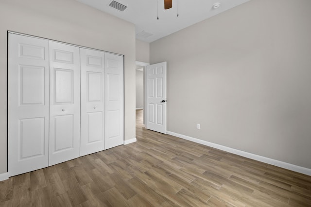 3269 NW 24th Ave, Okeechobee, FL 34972 - unfurnished bedroom with wood finished floors, baseboards, a closet, and ceiling fan