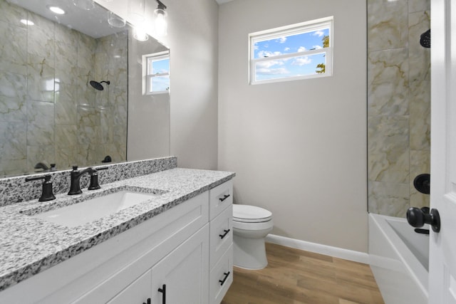 3269 NW 24th Ave, Okeechobee, FL 34972 - bathroom featuring wood finished floors, toilet, vanity, and baseboards