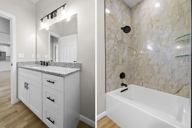 3269 NW 24th Ave, Okeechobee, FL 34972 - bathroom with tub / shower combination, wood finished floors, vanity, and baseboards