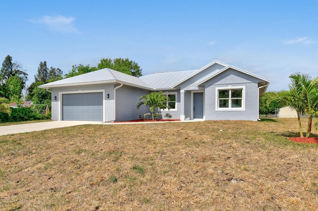 3269 NW 24th Ave, Okeechobee, FL 34972 - single story home with a garage, a front yard, driveway, stucco siding, and metal roof