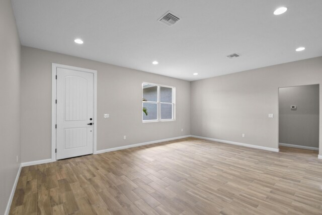 3269 NW 24th Ave, Okeechobee, FL 34972 - empty room featuring light wood finished floors, baseboards, and recessed lighting