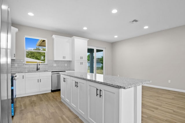 3269 NW 24th Ave, Okeechobee, FL 34972 - kitchen featuring a sink, stainless steel appliances, a kitchen island, healthy amount of natural light, and recessed lighting
