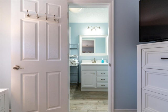 71 S Las Olas Dr, Jensen Beach, FL 34957 - bathroom featuring vanity and wood finished floors