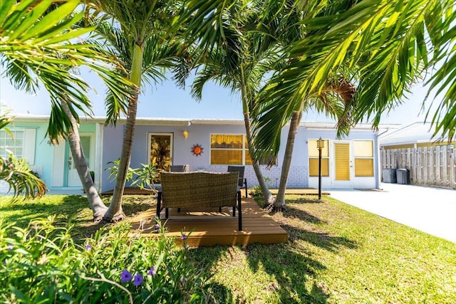 71 S Las Olas Dr, Jensen Beach, FL 34957 - ranch-style home with a deck, stucco siding, and driveway