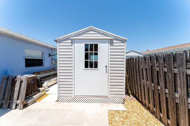 71 S Las Olas Dr, Jensen Beach, FL 34957 - view of shed featuring fence