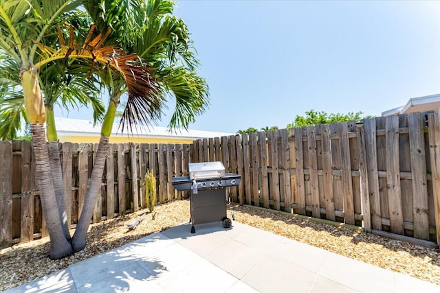 71 S Las Olas Dr, Jensen Beach, FL 34957 - view of patio with grilling area and fence
