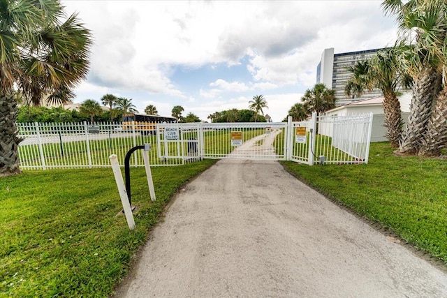 71 S Las Olas Dr, Jensen Beach, FL 34957 - view of street with a gate and a gated entry