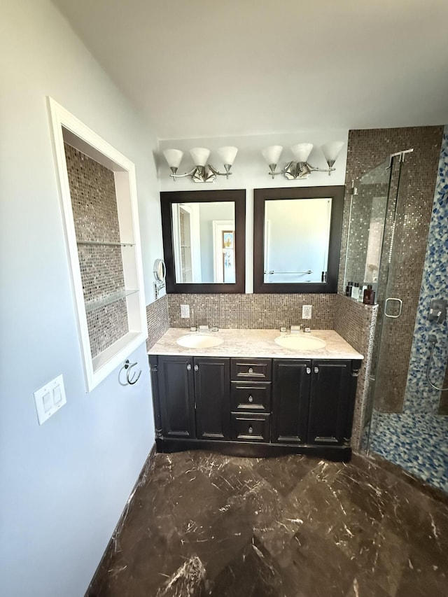 257 SW 5th St, Boca Raton, FL 33432 - bathroom featuring a stall shower, double vanity, and backsplash
