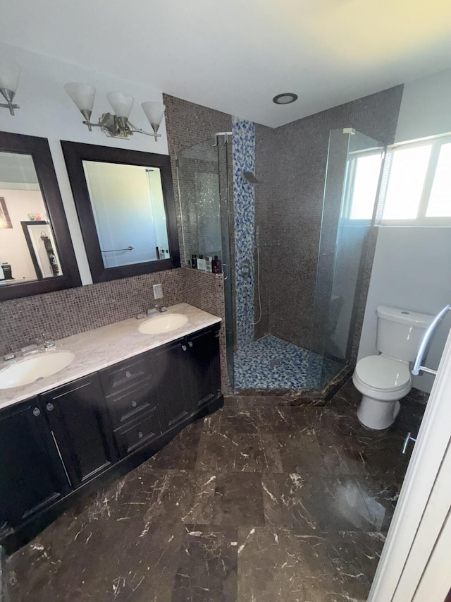 257 SW 5th St, Boca Raton, FL 33432 - full bath featuring a shower stall, toilet, double vanity, marble finish floors, and tasteful backsplash