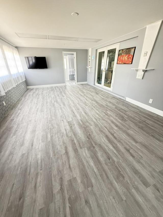 257 SW 5th St, Boca Raton, FL 33432 - unfurnished living room with wood finished floors and baseboards