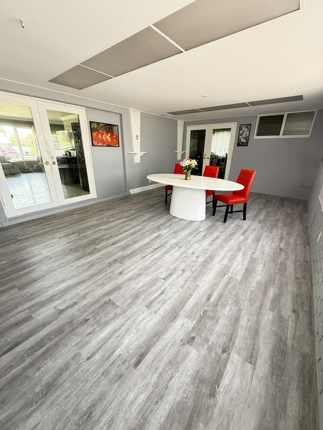 257 SW 5th St, Boca Raton, FL 33432 - dining area featuring wood finished floors, plenty of natural light, and french doors