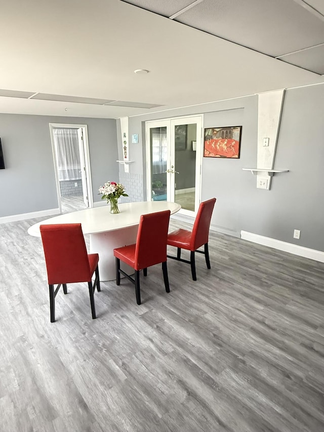 257 SW 5th St, Boca Raton, FL 33432 - dining space with wood finished floors, baseboards, and french doors