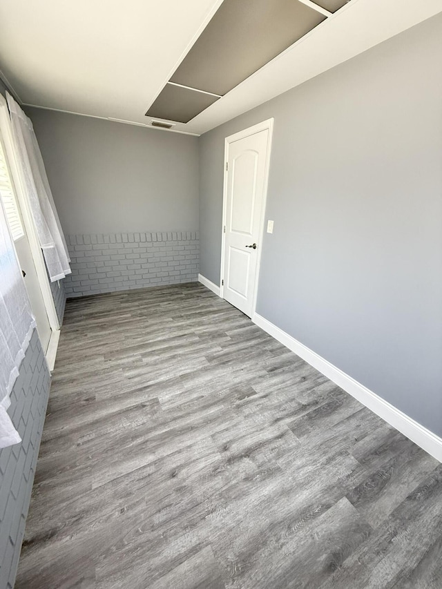 257 SW 5th St, Boca Raton, FL 33432 - empty room featuring wood finished floors and baseboards