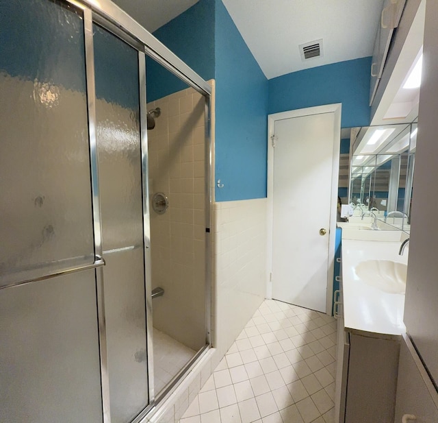 257 SW 5th St, Boca Raton, FL 33432 - bathroom featuring tile patterned flooring, a shower stall, and double vanity