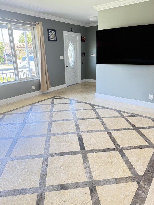 257 SW 5th St, Boca Raton, FL 33432 - entrance foyer with inlaid floor details, ornamental molding, baseboards, and healthy amount of natural light