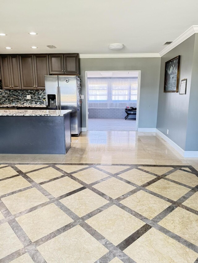 257 SW 5th St, Boca Raton, FL 33432 - kitchen with inlaid floor details, baseboards, crown molding, and recessed lighting