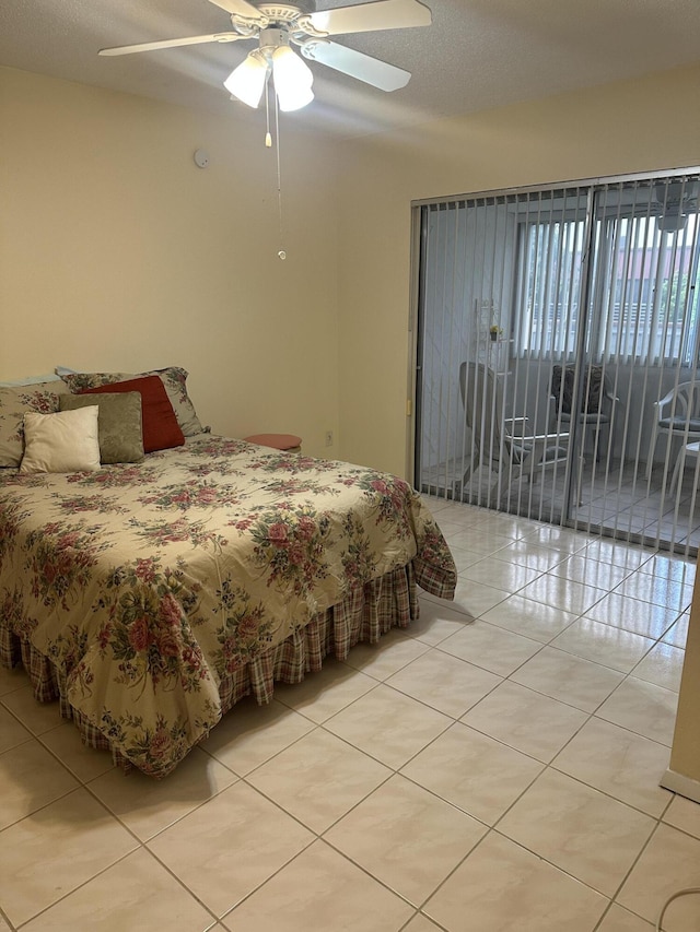 bedroom with light tile patterned floors, access to outside, and ceiling fan