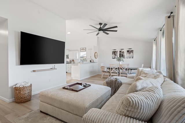 5157 Canal Cir S, Lake Worth, FL 33467 - living room with vaulted ceiling, ceiling fan, baseboards, and light wood-type flooring
