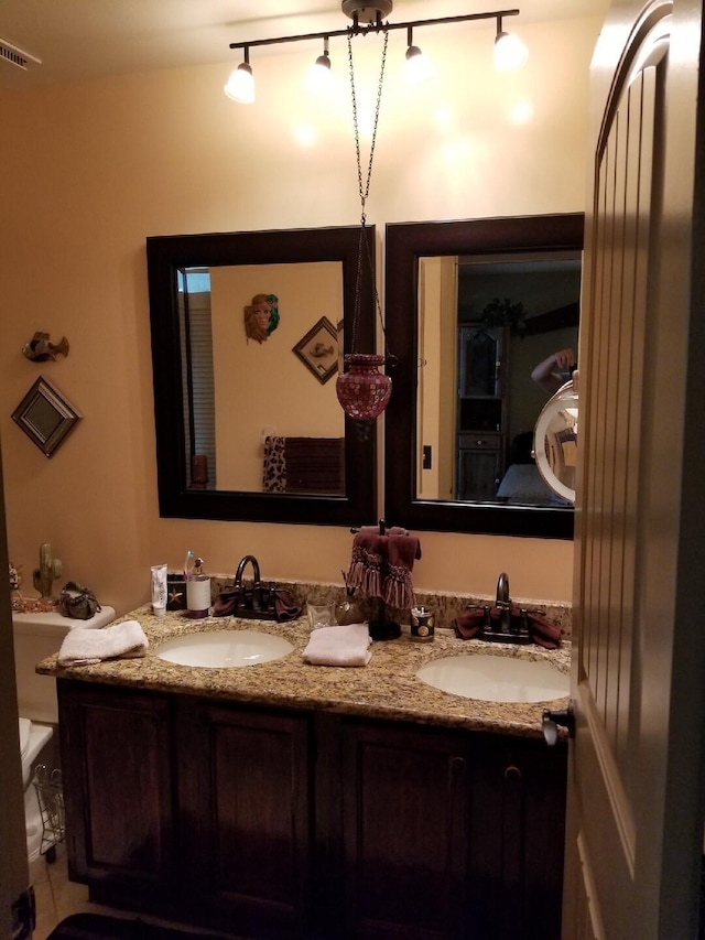 2010 Colonial Rd Unit 3, Fort Pierce, FL 34950 - full bath with double vanity, rail lighting, and toilet