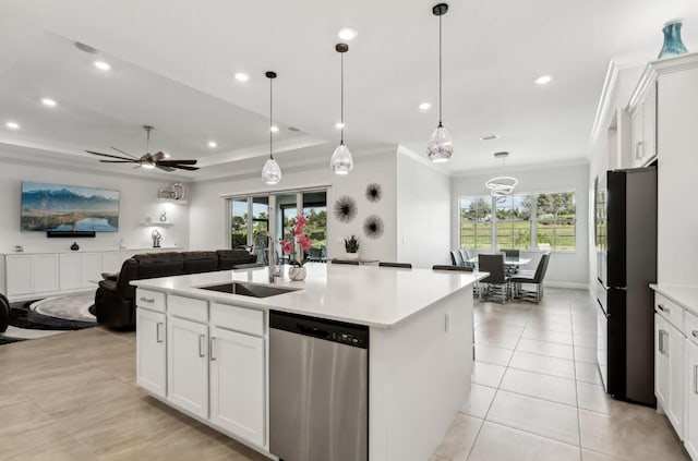 822 Hookline Cir, Loxahatchee, FL 33470 - kitchen with stainless steel dishwasher, freestanding refrigerator, a sink, ornamental molding, and light countertops