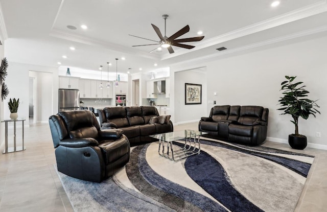 822 Hookline Cir, Loxahatchee, FL 33470 - living area featuring a tray ceiling, recessed lighting, ceiling fan, crown molding, and baseboards