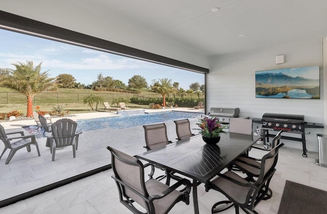 822 Hookline Cir, Loxahatchee, FL 33470 - fenced backyard with a patio area, an outdoor pool, a grill, and outdoor dining area