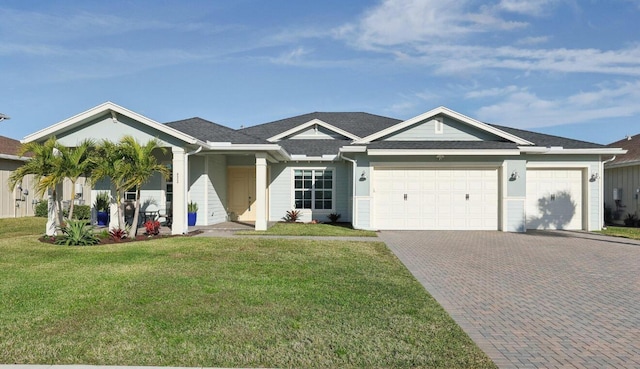 822 Hookline Cir, Loxahatchee, FL 33470 - ranch-style house featuring decorative driveway, a front lawn, and an attached garage