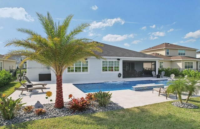 822 Hookline Cir, Loxahatchee, FL 33470 - back of property featuring a patio, a sunroom, and an outdoor pool