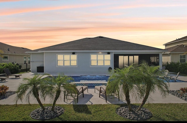 822 Hookline Cir, Loxahatchee, FL 33470 - rear view of house with a patio area and a shingled roof