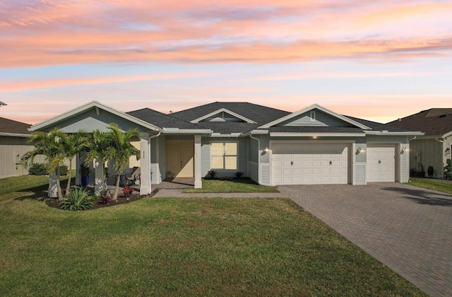 822 Hookline Cir, Loxahatchee, FL 33470 - ranch-style house featuring decorative driveway, an attached garage, and a front lawn