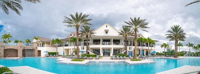 822 Hookline Cir, Loxahatchee, FL 33470 - community pool featuring stairs and a patio area