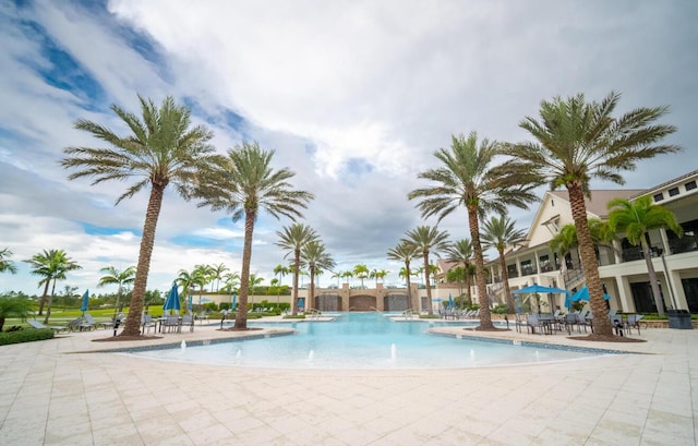 822 Hookline Cir, Loxahatchee, FL 33470 - community pool featuring a patio area