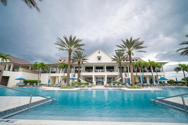 822 Hookline Cir, Loxahatchee, FL 33470 - community pool featuring stairs and a patio area