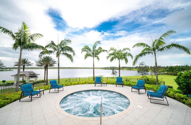 822 Hookline Cir, Loxahatchee, FL 33470 - view of pool with a community hot tub, a water view, and a patio