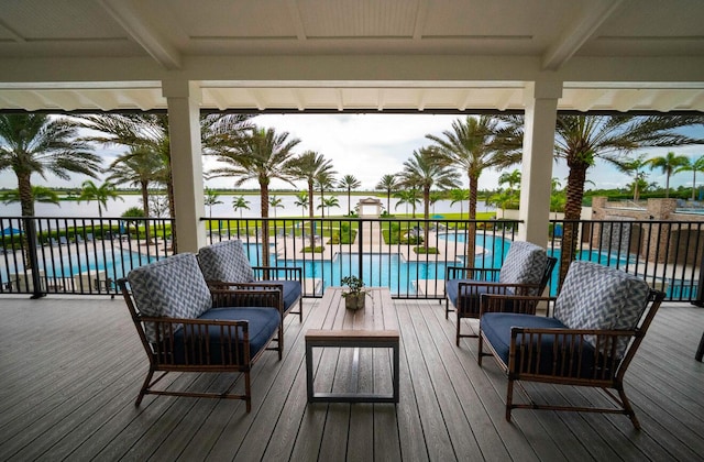 822 Hookline Cir, Loxahatchee, FL 33470 - wooden deck featuring an outdoor living space and a community pool