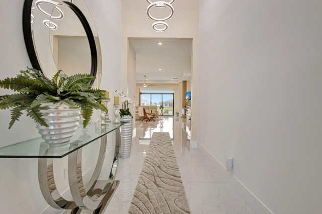 5320 Saint Armands Way, Westlake, FL 33470 - corridor with marble finish flooring, baseboards, and recessed lighting