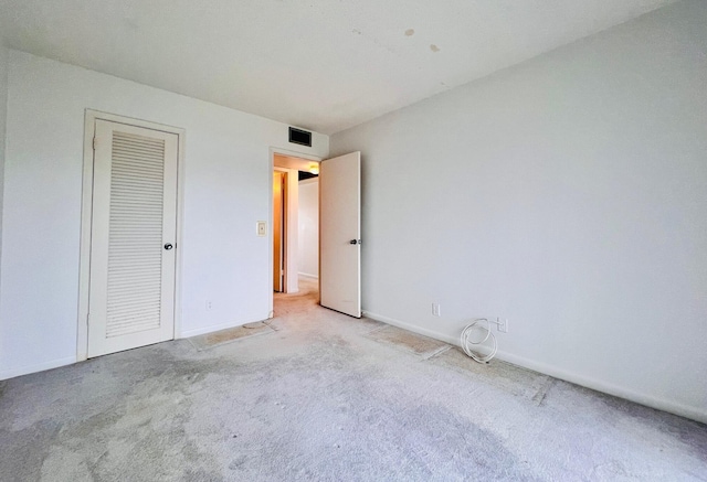 341 Northampton Q, West Palm Beach, FL 33417 - unfurnished bedroom featuring carpet, baseboards, and a closet